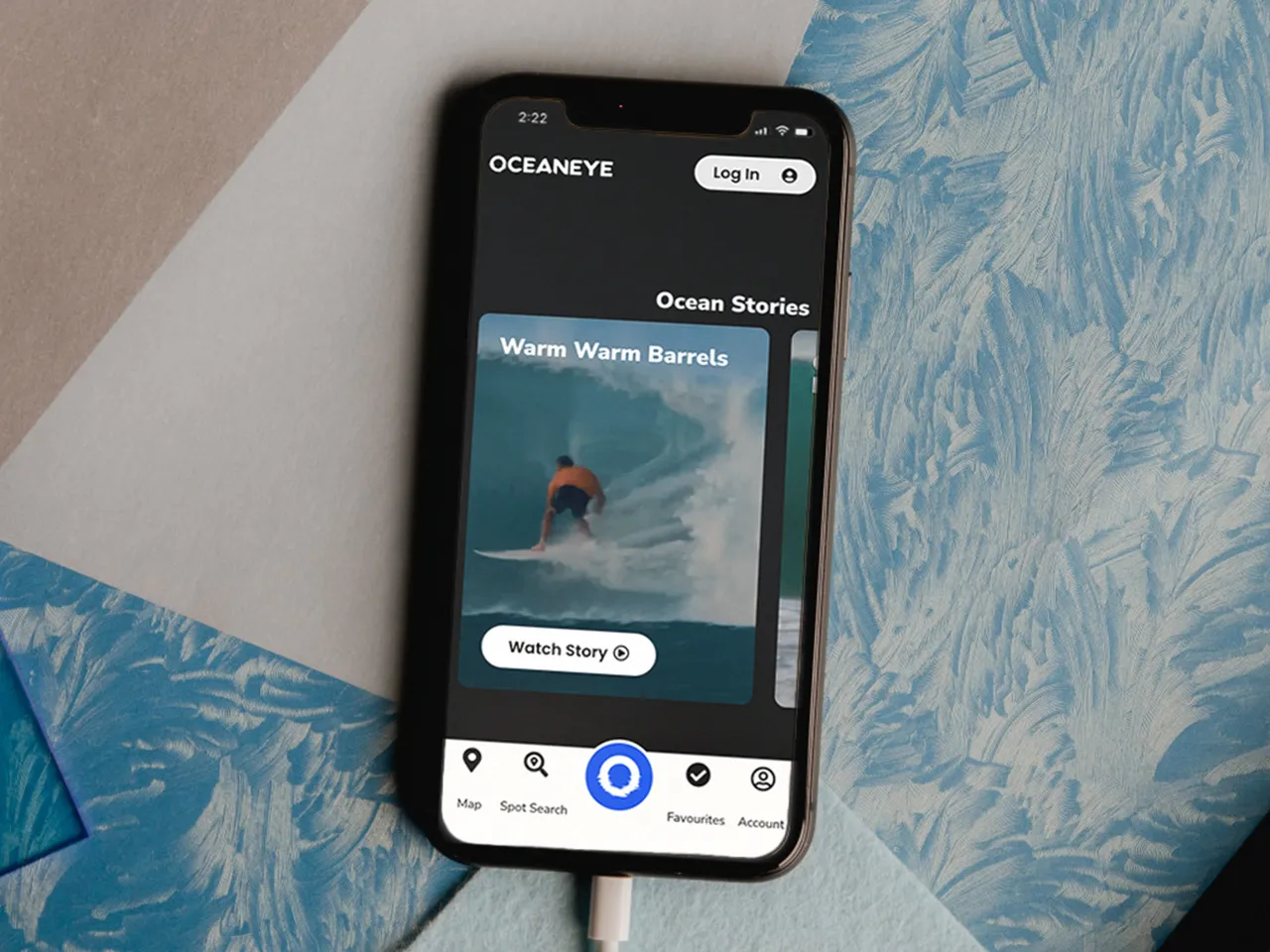 OceanEye on a phone: Ocean Stories, with the map, spot search and favourites along the bottom